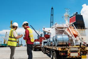 Workers talking next to truck